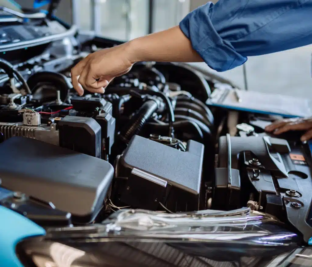 a person working on a car engine