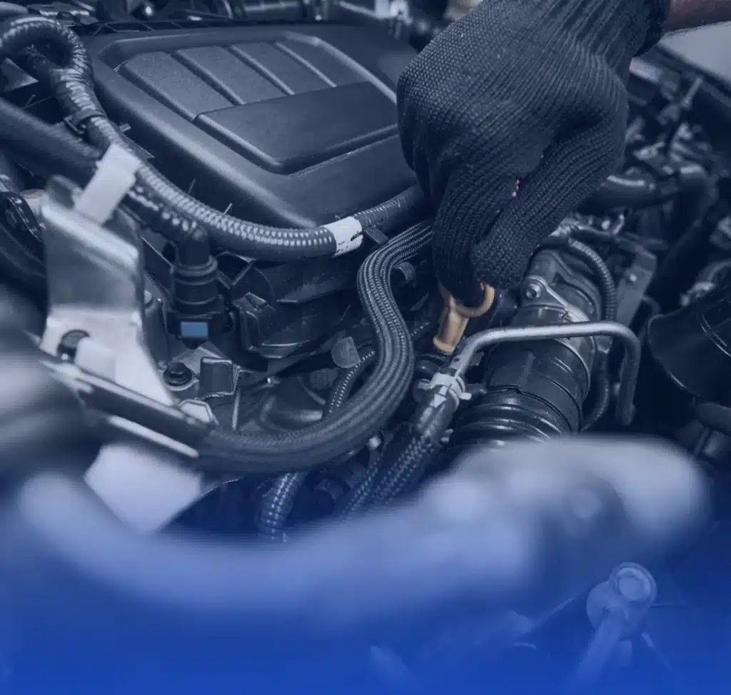 a person working on a car engine